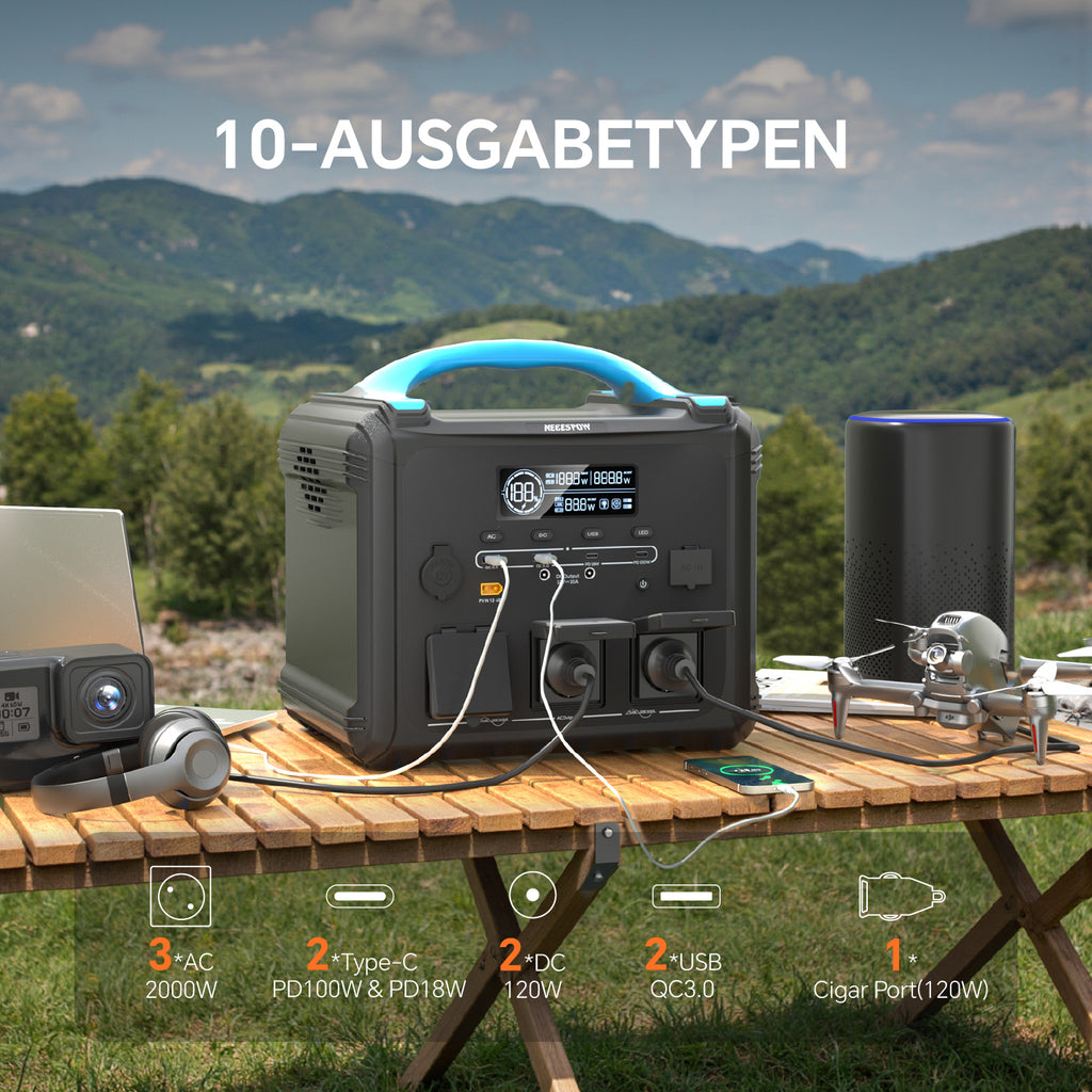NECESPOW 2000W Solar Generator on a picnic table with a mountain backdrop